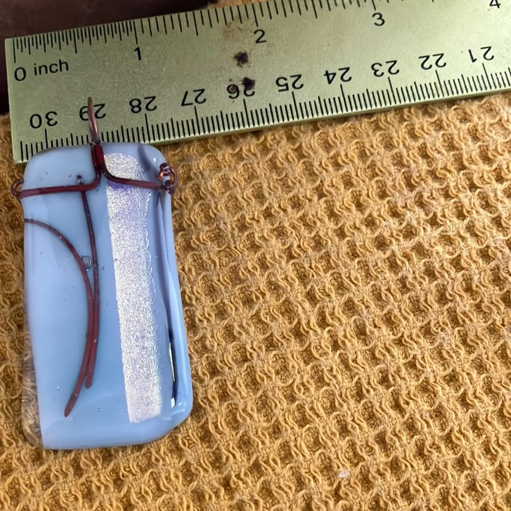 Light blue wire wrapped glass pendant